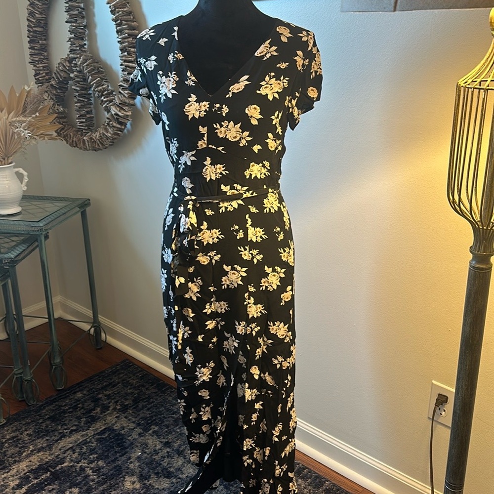 This beautiful long dress is floor length with a slit up to mid thigh